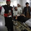 Medics move an injured member of the security personnel at a hospital in Peshawar on February 15, 2017, after a suicide bombing on a government compound in Mohmand tribal agency in Pakistan's northwest