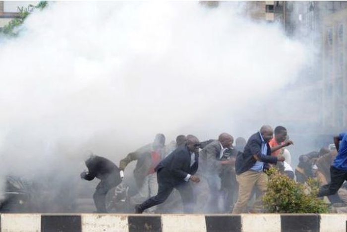 File image of police using teargas canisters to disperse rowdy crowds at a past political event. Police moved in swiftly to disperse rowdy youths who attempted to disrupt a Team Embrace ally in Garissa on Saturday