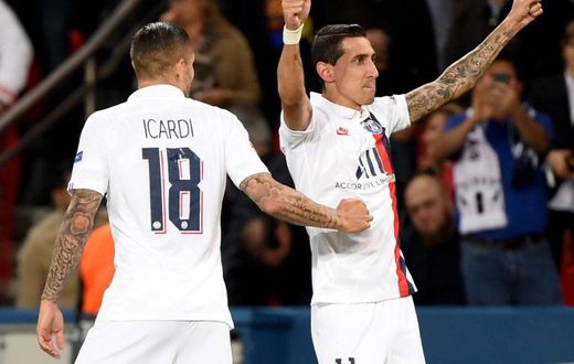Angel Di Maria celebrates with Mauro Icardi after scoring one of his two goals as Paris Saint-Germain beat Real Madrid 3-0 in their Champions League opener