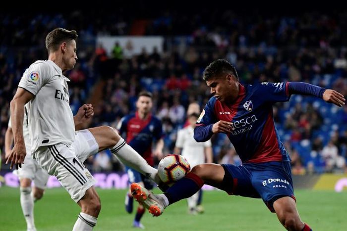 Spanish midfielder Marcos Llorente (left) has agreed a transfer from Real Madrid to Atletico.