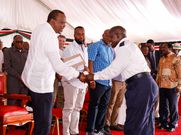President Uhuru Kenyatta congratulates one of 136 Kenyans who have gained employment as seafarers on several ships owned by the Mediterranean Shipping Company (MSC). (courtesy)