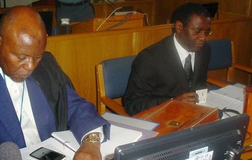 Ngirabatware, right, seated next to his lawyer at the start of his trial in 2008