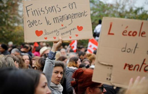 Thousands of French teachers demonstrated in solidarity with a principal who committed suicide after complaining about a work overload leaving her 'exhausted'
