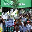 Thousands of olive growers, many waving olive branches, protested in Madrid on Thursday against the impending tariffs