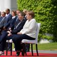 German Chancellor Angela Merkel and Denmark's Prime Minister Mette Frederiksen sat as they listened to the national anthems