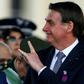 Brazilian President Jair Bolsonaro, pictured here in August 2019, said he would return to work after another operation following his stabbing a year ago