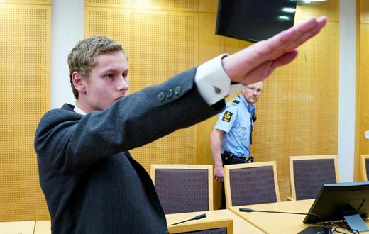 Police say Philip Manshaus, seen giving a Nazi salute at a court appearance on September 9, killed his Chinese origin step-sister in a racist attack before opening fire in an Oslo mosque