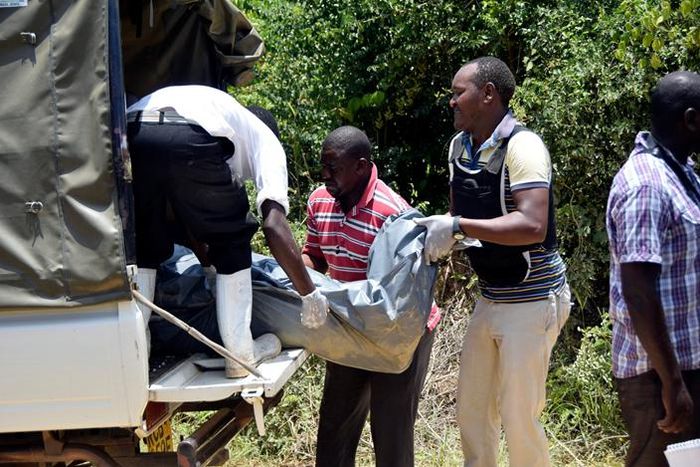Police officers loading a dead body in a van in a past murder