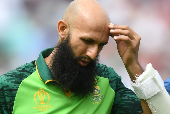 South Africa's Hashim Amla walks back to the pavilion after being hit on the head by England's Jofra Archer in the opening match of the World Cup