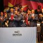 Mozambique's President Filipe Nyusi and Renamo leader Ossufo Momade hug after signing the landmark peace agreement on August 6