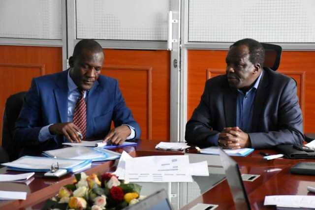 LREB CEO Abala Wanga (L) with Kakamega Governor Wycliffe Oparanya. Abala resigned from LREB on Tuesday to return to his position as Governor Anyang' Nyong'o advisor