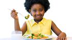 Little girl eating healthy