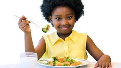 Little girl eating healthy
