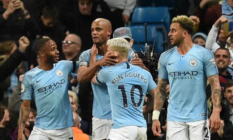 Kompany man: Manchester City captain Vincent Kompany celebrates his goal against Leicester