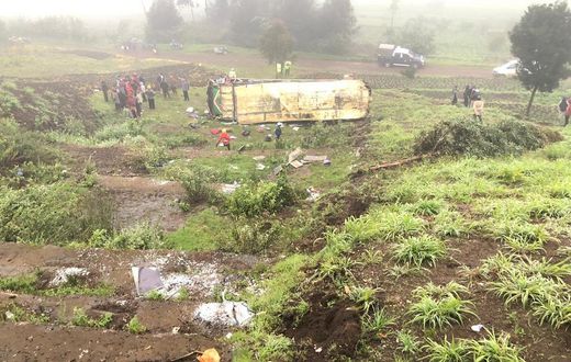 Mbukinya bus full of passengers rolls off the Kinungi black spo
