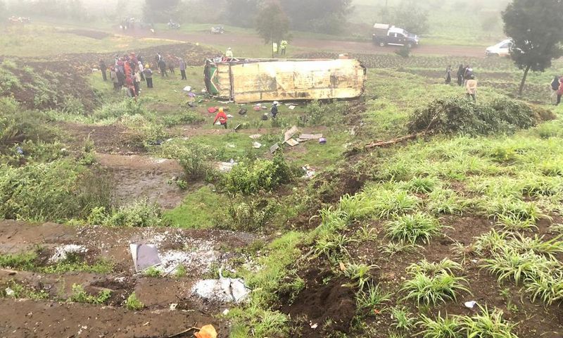 Mbukinya bus full of passengers rolls off the Kinungi black spo