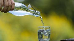 Pouring water in a glass