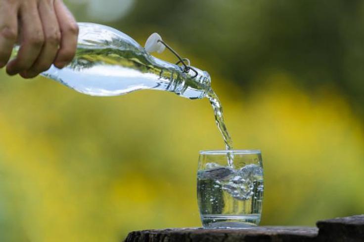 Pouring water in a glass