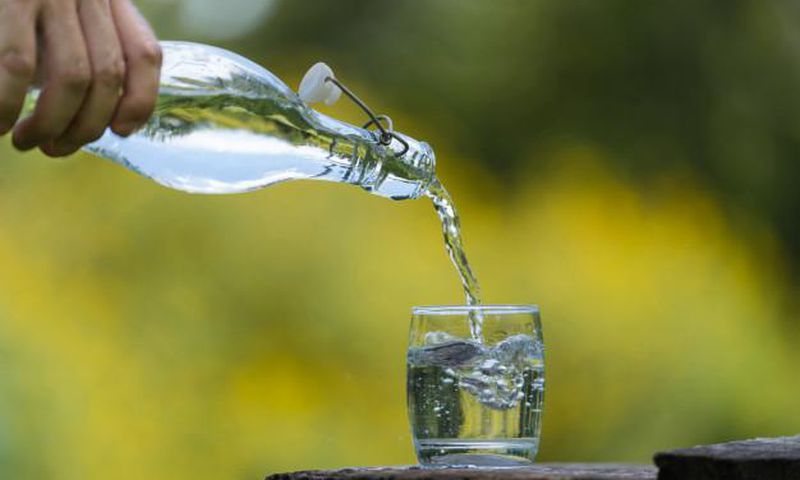 Pouring water in a glass