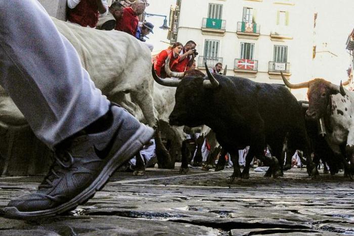 Participants take place in the San Fermin festival running of the bulls in Pamplona, northern Spain in July 2019