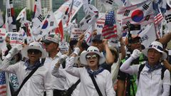 Supporters of South Korea's former president Park Geun-hye rally outside the Supreme Court, which ordered she face a new trial on graft charges