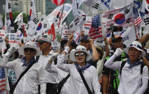 Supporters of South Korea's former president Park Geun-hye rally outside the Supreme Court, which ordered she face a new trial on graft charges