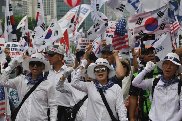 Supporters of South Korea's former president Park Geun-hye rally outside the Supreme Court, which ordered she face a new trial on graft charges