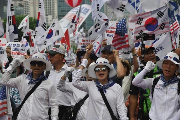 Supporters of South Korea's former president Park Geun-hye rally outside the Supreme Court, which ordered she face a new trial on graft charges