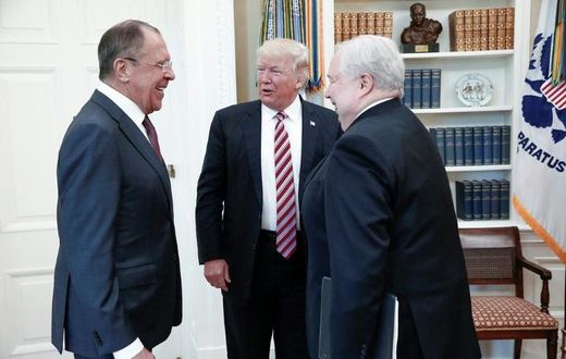 US President Donald Trump (C) speaks with Russian Foreign Minister Sergei Lavrov (L) and Russian Ambassador to the US Sergei Kislyak during their meeting at the White House in May 2017, in a photo made available by the Russian Foreign Ministry
