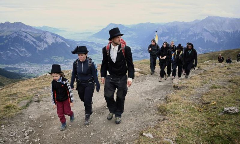 The solemn two-hour "funeral march" led up the side of Pizol mountain in northeastern Switzerland to the foot of the rapidly melting ice formation