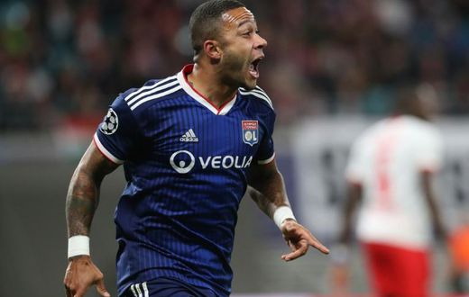 Memphis Depay celebrates scoring the opening goal at RB Leipzig on Wednesday
