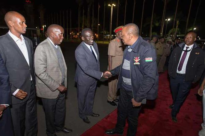 File image of President Uhuru Kenyatta at Jomo Kenyatta International Airport during a past foreign trip