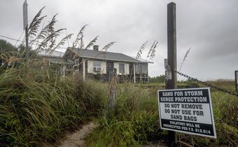 Churning North, Hurricane Drubs Weary Carolinas