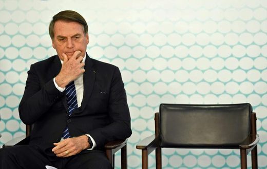 (FILES) In this file photo taken on September 06, 2019, Brazilian President Jair Bolsonaro gestures during the launching ceremony of the new student ID at Planalto Palace in Brasilia