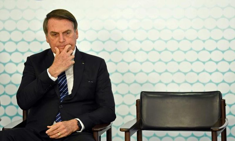 (FILES) In this file photo taken on September 06, 2019, Brazilian President Jair Bolsonaro gestures during the launching ceremony of the new student ID at Planalto Palace in Brasilia