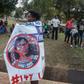 A protester in July carries a banner calling for the ousting of Malawi Electoral Commission chairwoman Jane Ansah