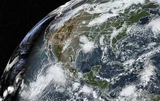 This satellite image obtained from NOAA/RAMMB, shows Hurricane Lorena (L) on September 19, 2019 as it made landfall on the southwest coast of Mexico
