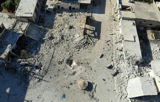Destruction and damaged buildings from Syrian government forces' bombardment are pictured in Idlib province, where close to 1,000 civilians have been killed
