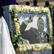 Former first lady Grace Mugabe walks past a portrait of Robert Mugabe during the burial of the former Zimbabwe leader at his home village in Kutama, west of the capital Harare