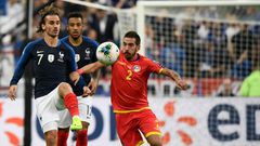 Antoine Griezmann (L) missed a penalty but later set up a goal as France eased to a 3-0 win over lowly Andorra in Euro 2020 qualifying