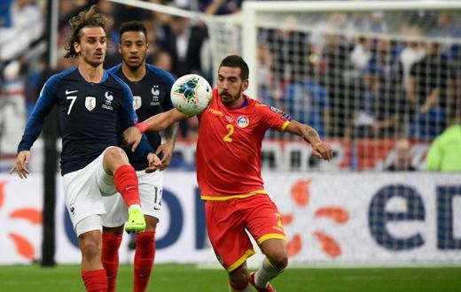 Antoine Griezmann (L) missed a penalty but later set up a goal as France eased to a 3-0 win over lowly Andorra in Euro 2020 qualifying