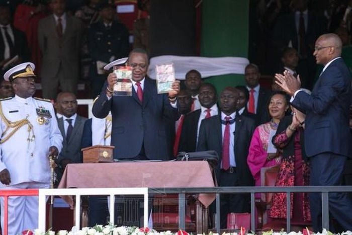 Preident Uhuru Kenyatta with CBK Governor Patrick Njoroge during the launch of new bank notes in Narok