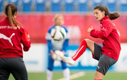 Swiss player Florijana Ismaili (R) takes part in a training session at the FIFA Women's World Cup at Clark Stadium in Edmonton, Canada on June 13, 2015