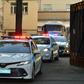 A police convoy escorts two buses with tinted windows from the high-security prison of Lefortovo in Moscow as a long-awaited exchange of prisoners between Moscow and Kiev gets underway