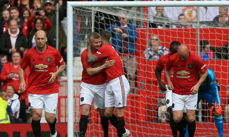 Manchester United '99 Legends celebrate a goal against Bayern Munich in a charity match
