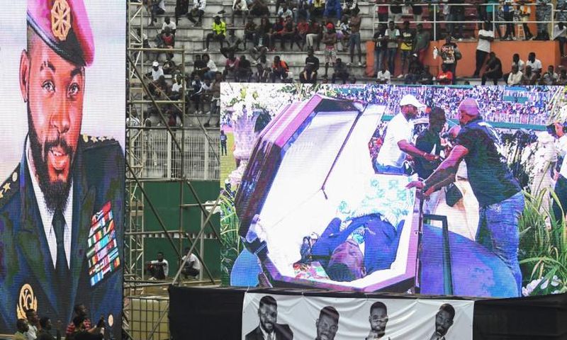 DJ Arafat's coffin was placed at the centre of the football pitch