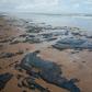 A handout picture released by the Sergipe State Environment Administration on September 25, 2019, shows oil spilled on a beach in Pirambu, Sergipe state, Brazil