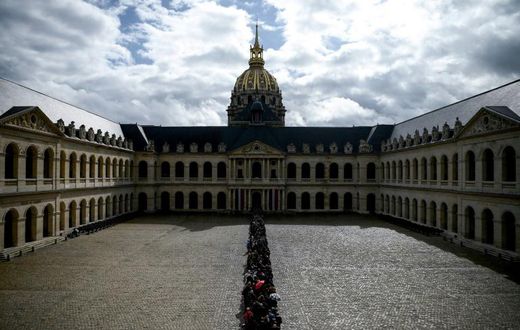 A massive queue snaked around the Invalides complex to pay homage at Jacques Chirac's coffin ahead of a national day of mourning on Monday