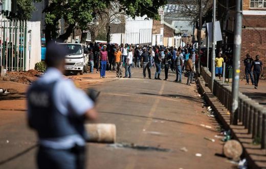 Gangs of aggressors armed with sticks and machetes attacked businesses in South Africa's financial capital last month during deadly xenophobic attacks