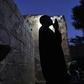 Issa Haidari, who shelters people displaced by violence in Mali, prays after nightfall in the garden at his home in Segou